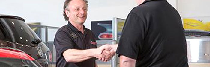 A Rossi salesman shaking hands with customer
